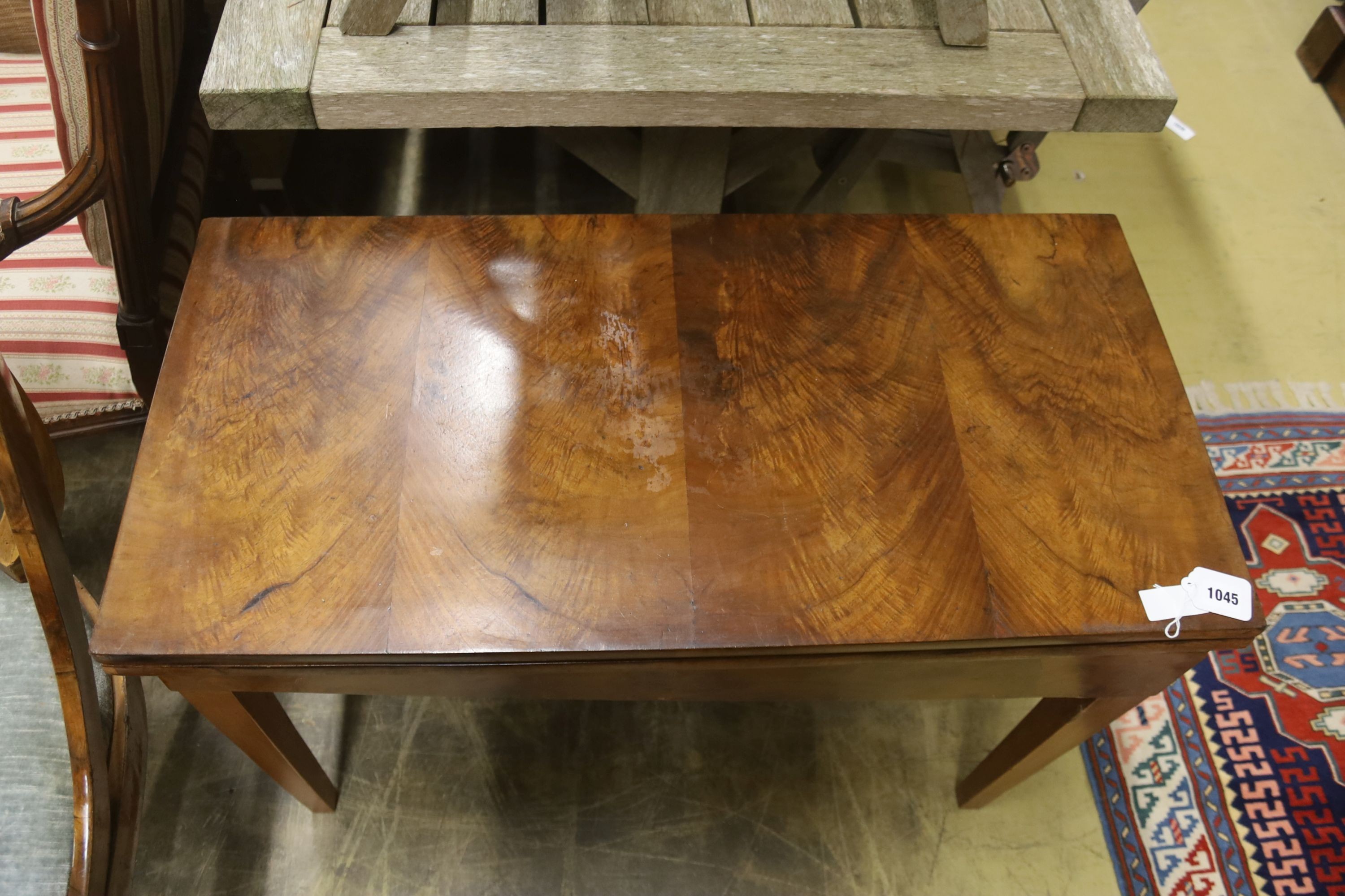 A 19th century Continental walnut rectangular tea table with folding top, (cut down), width 89cm, dpeth 44cm, height 63cm